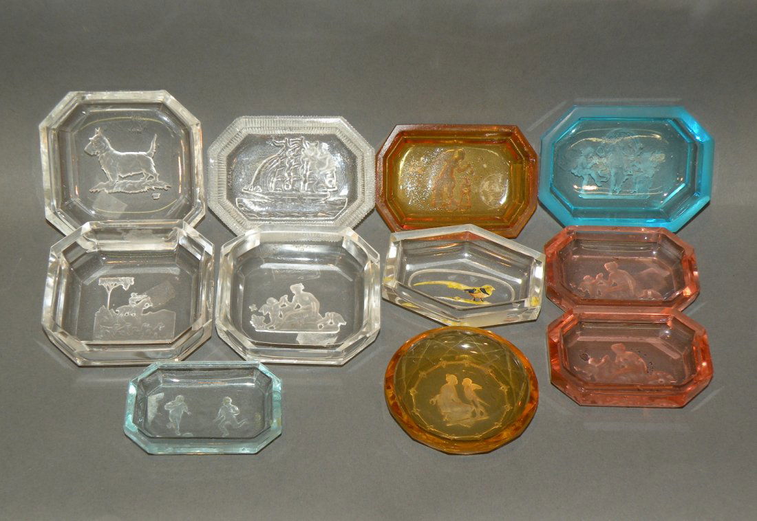 11 Intaglio cut glass salts: ca. 1900-40; cut and pressed glass in various colors, 2 ¼”- 2 ¾”;