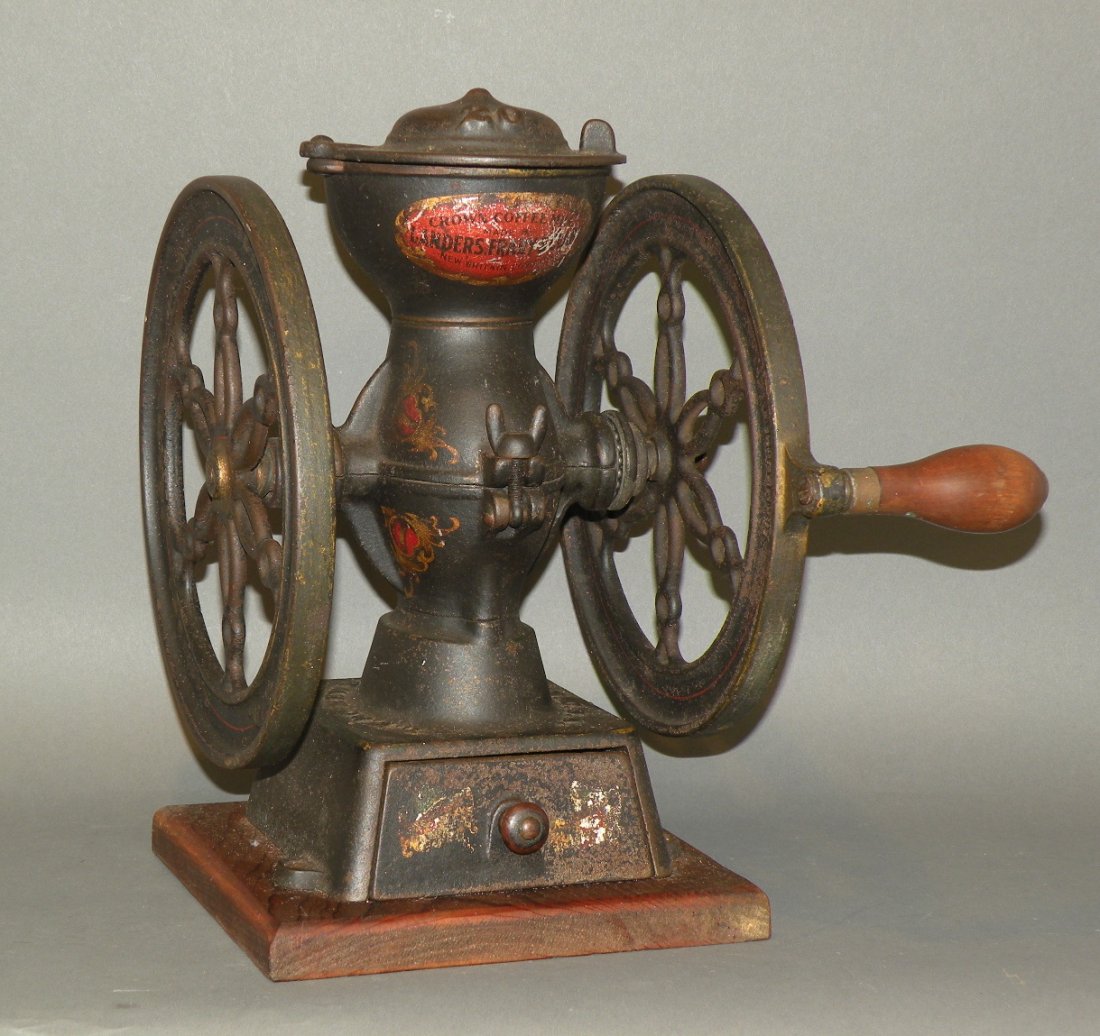 Landers, Frary & Clark coffee mill: ca. 1870-95; cast iron with drawer, two wheeled mill, black paint and original decal decoration made in New Britain, Conn., 10 ¾”x 8 5/8”x 12 ¼”;