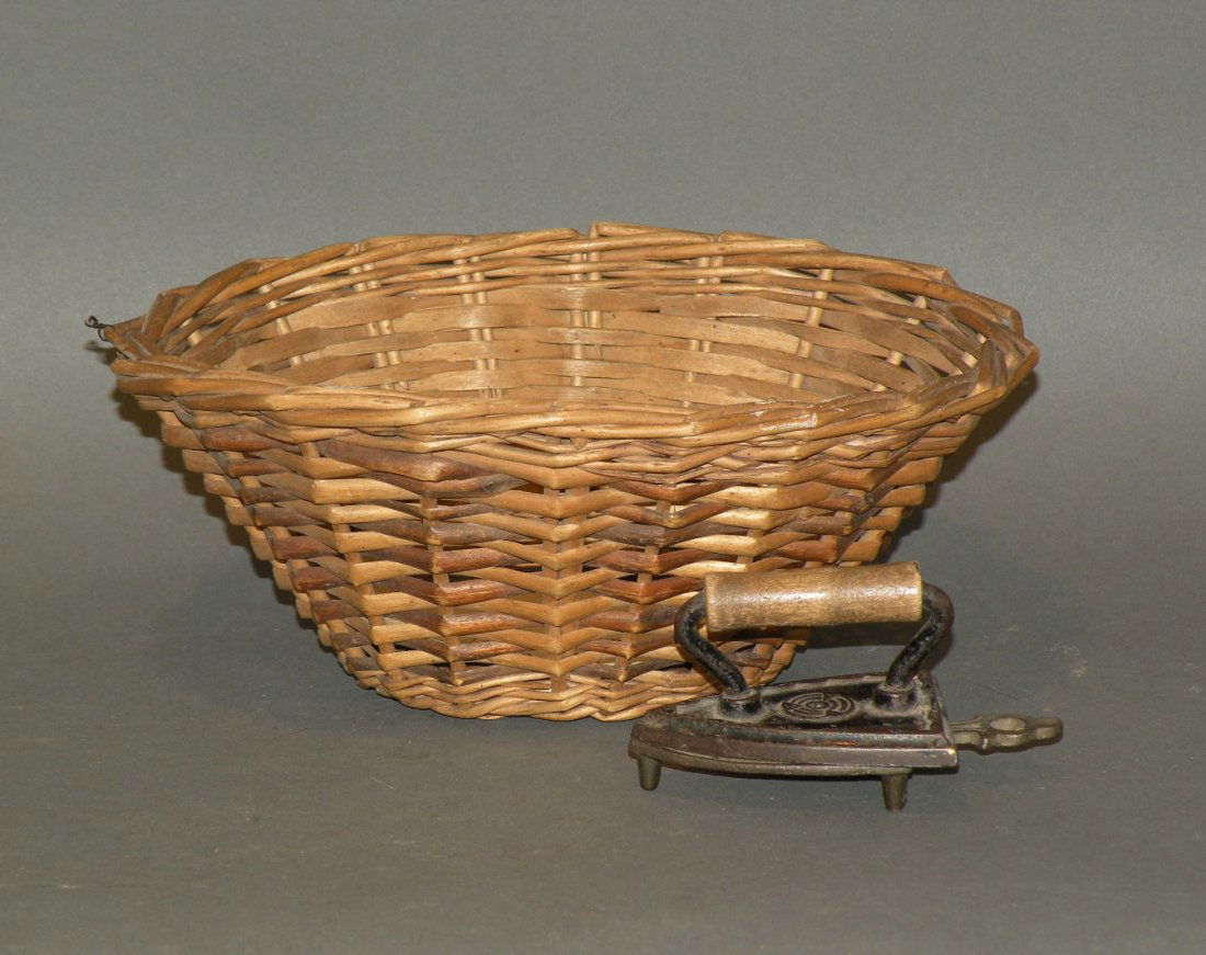 Child’s wash basket with iron & trivet: ca. 1890s; reed basket with dated tag, 8”; cast iron wooden handle iron and trivet, 2 ¾”;