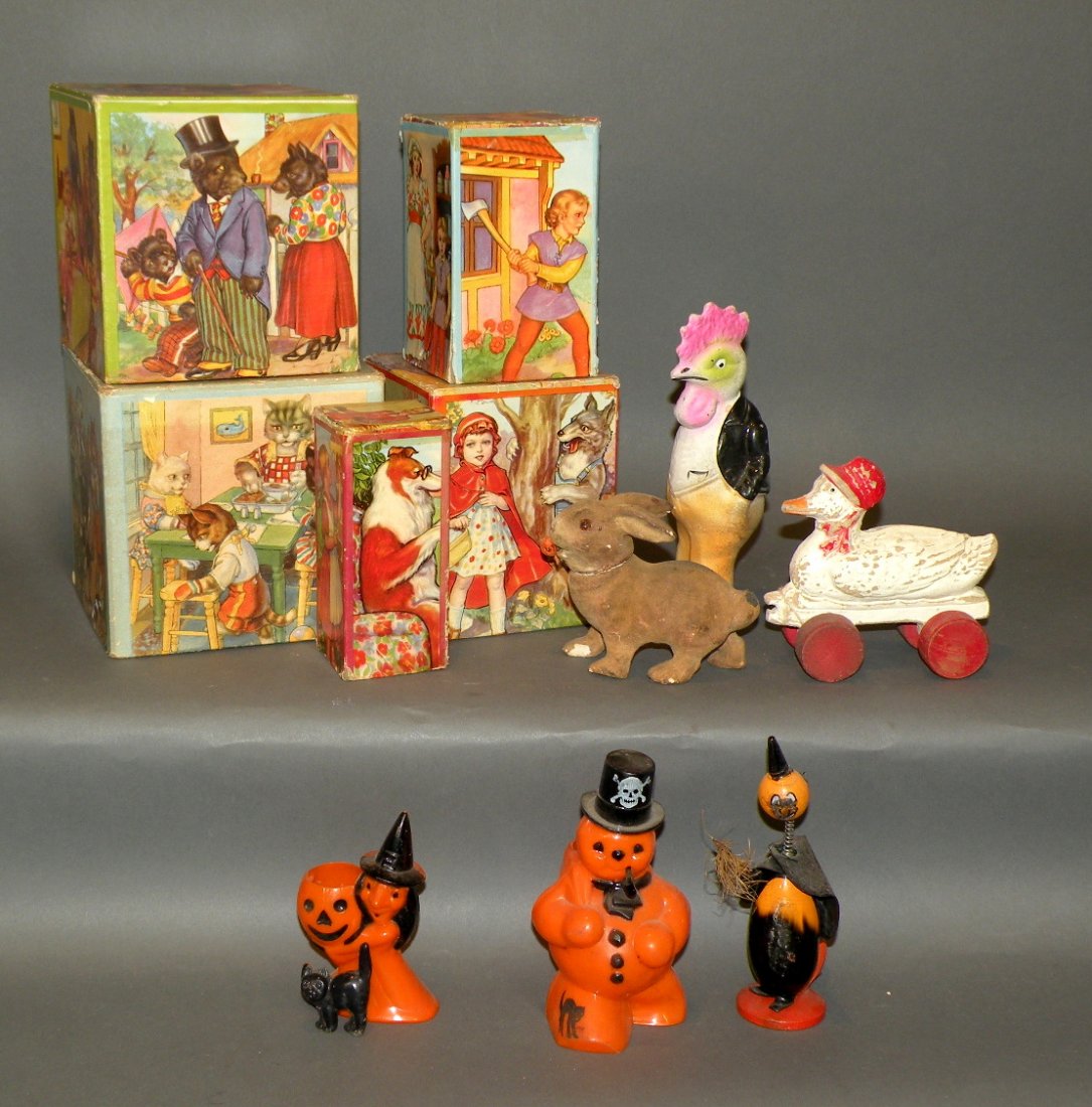 Tray lot of toys: ca. 1940-50; paper litho German nest of five blocks, papier mache candy rabbit and rooster, three plastic Halloween toys, wheeled duck;