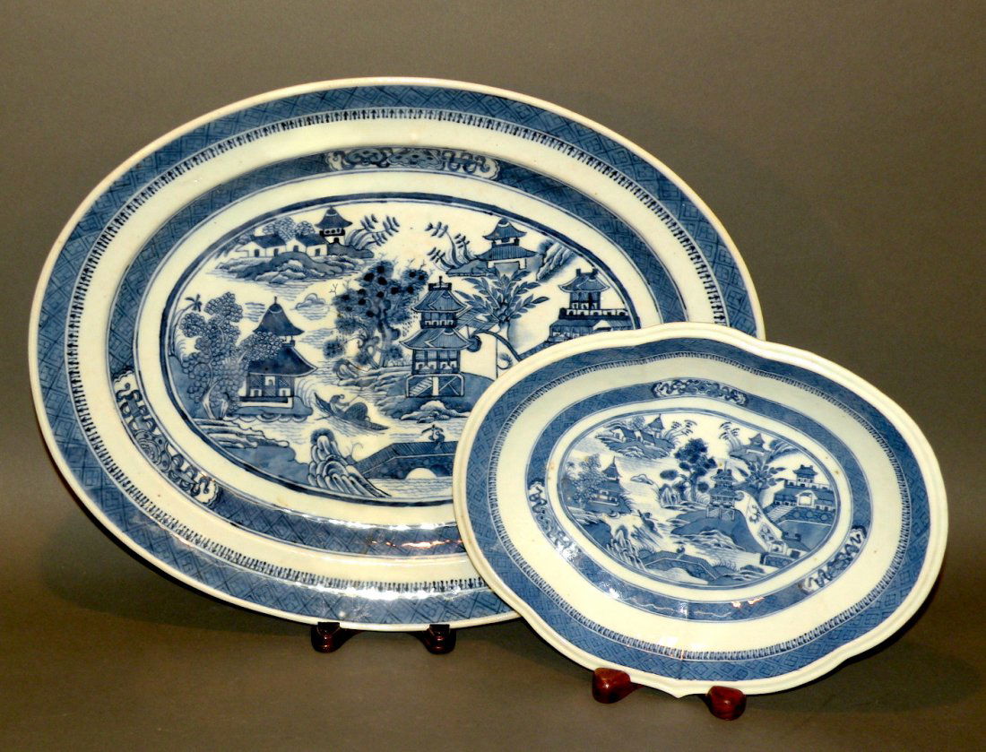 2 Chinese Export platters: ca. 1820; Nanking pattern oval platter with orange peel glaze, 13 1/8”x 16 5/8”; Nanking pattern irregular oblong lobed platter with open serving dish, reeded rim and table ring, 8 5/8”x 10 7/8�