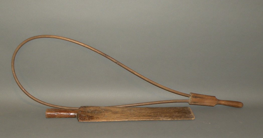 Rug beater & scutching knife: ca. 1780-1880; shaker style beater with bentwood frame, 37 ¼”x 11 ¼”x 1”; oak scutching knife, 22 ½”x 3 7/8”x 1 ¼”;