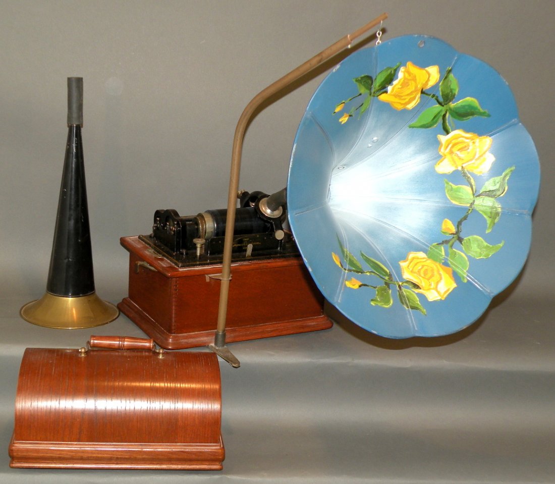 Edison cylinder record player with horns & cylinde: ca. 1910; oak cased with standard horn, painted 15” morning glory horn and 4 cylinders, 13”x 21”;