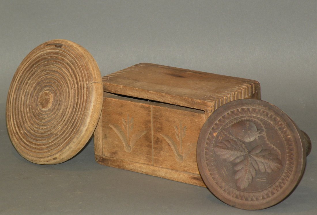 Boxed butter mold & 2 butter prints: ca. 1860-1910; machine dovetailed box with foliage design print, 5 5/8”x 3 3/8”x 4 ¼”; print carved with fruit design and applied handle, 3 ¾”x 5 ¾”; print with concentric circle pattern 