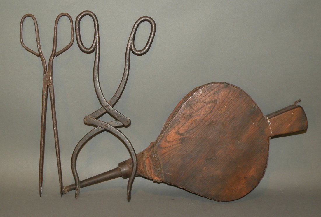 3 fireplace tools: ca. 1700-1800s; walnut bellows with iron tip, 21”; hand wrought primitive pipe lighting tongs with spade tip, 15”; multi-jointed hand wrought tongs with pad tips, 16 ½”;