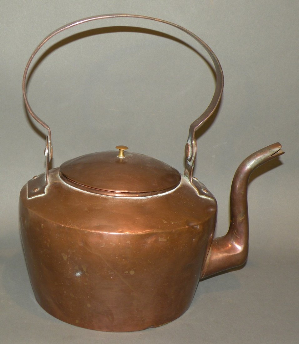 Copper tea kettle with bird’s neck spout: ca. 1700s; unsigned dovetailed construction kettle with broad loose copper handle and copper lid with brass knob, 13”x 12”;