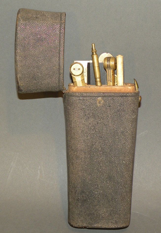 Orlun Buckley drafting set: ca. 1800-40; hard flip top case with “Orlund Buckley” marked in lid containing ivory folding rule, ivory straight rule, ebony and brass parallel rule, brass and metal compass and 3 spring tip draw