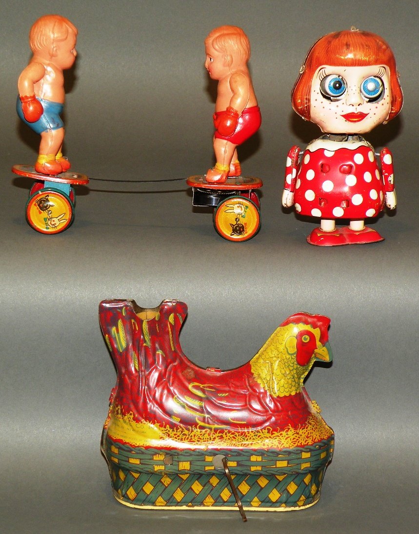 3 wind-up toys: ca. 1930-50; tin litho crank operated clucking and egg laying chicken, 5 ¼”; tin litho wind-up “Susie” with shaking head and body and pop out eyes, 5 ½”; celluloid swinging arm boxers on whe