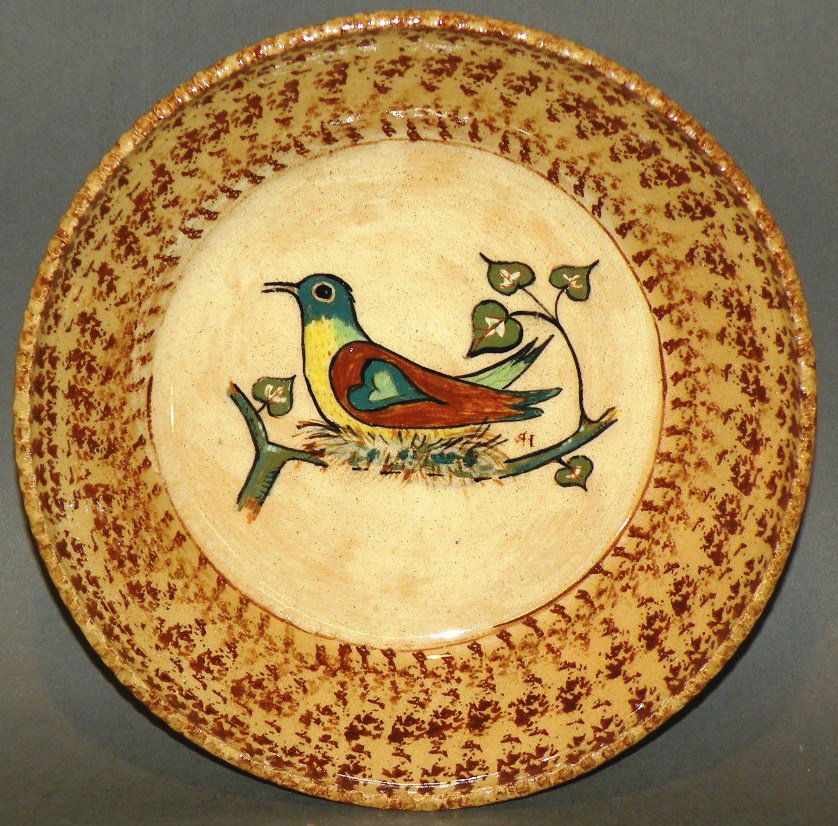 Left handed Russell Henry bowl: ca. 1970; maize glazed earthenware bowl with polychromal bird on nest design and incised “Hay Creek 7/6/70 Hay Creek Spatterware “Bird on Nest” Left Handed Russell Henry”, 6 ¾”d, 1 ½”h;