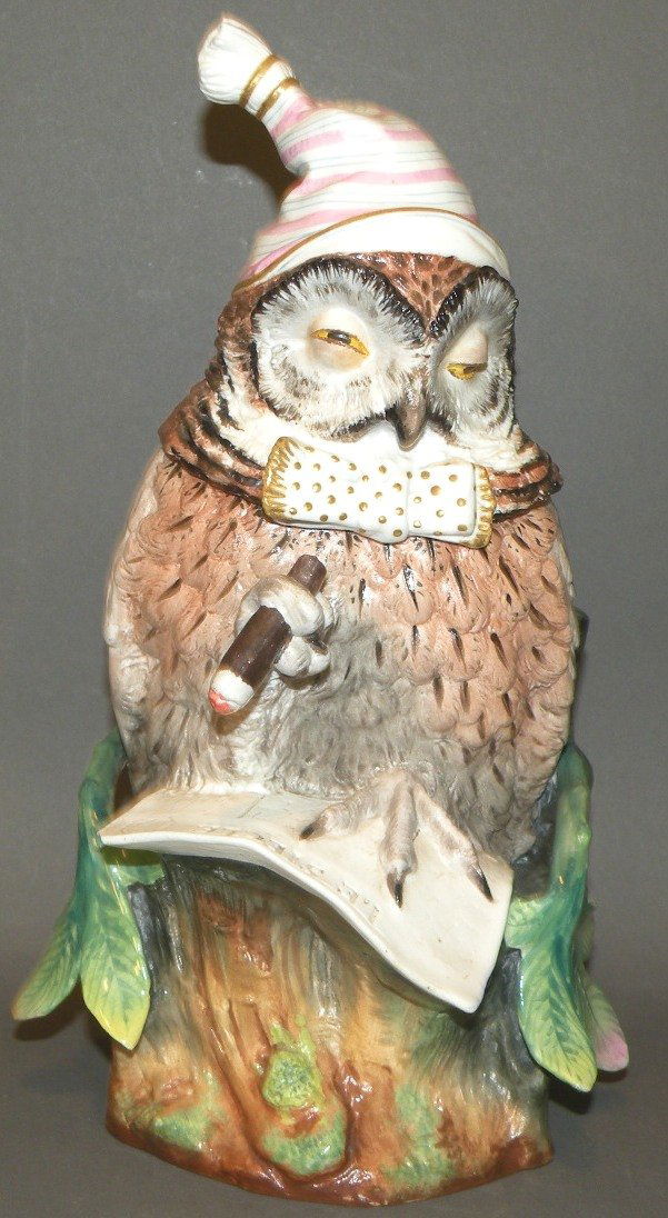 Porcelain owl tobacco jar: ca. 1890; polychromal continental porcelain with cigar in claw, stump with a copy of “Le Siecle” and base impressed “294”, 10 1/8”x 4 7/8”;