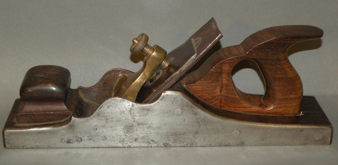 Spiers infill fore plane: ca. 1850-1900; handled steel bodied fore/jack plane with rosewood handle and infill, brass screw cap signed Spier, Ayre and iron and cap iron marked James Howarth, 13 ½”;
