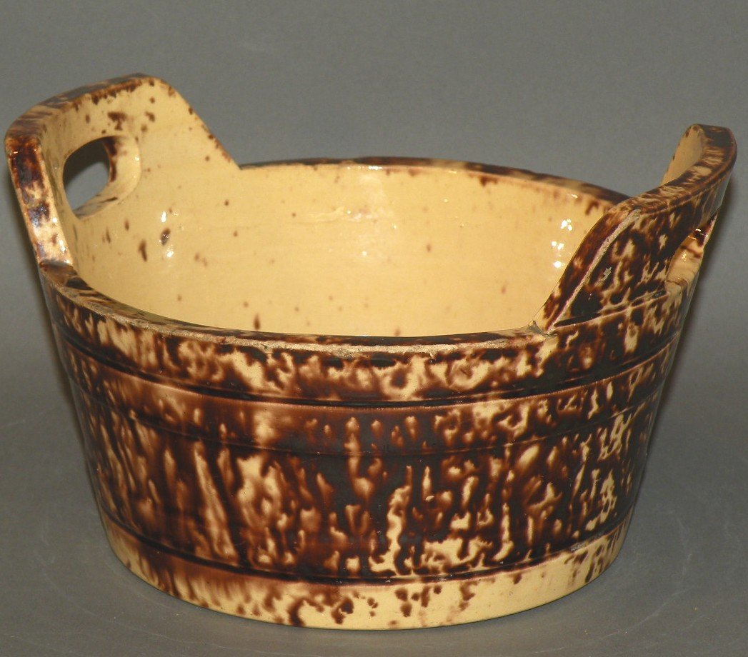 Rockingham glazed tub: ca. 1880; earthenware with tapered sides cut to form handles and incised lines on sides, 8 ¼”d, 4 7/8”h;