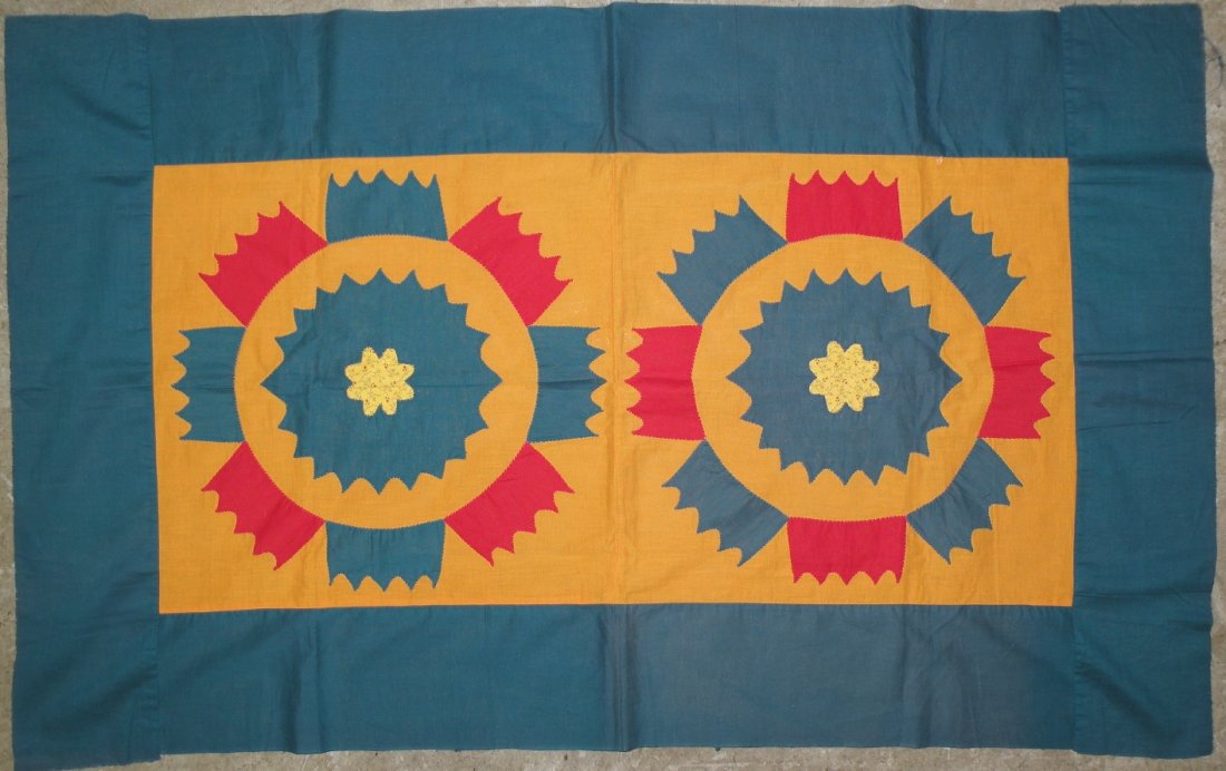 Crib quilt: ca. 1870; with two machine pieced and hand appliqued circular designs, 46”x 29”;