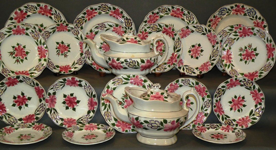 Set of Staffordshire: ca. 1840; Staffordshire earthenware with scalloped rims and painted stylized flowers and foliage design: two covered teapots with rosette finial, 6 5/8”x 5 7/8”x 11 3/8” & 7”x 6”x 11 7/8”;