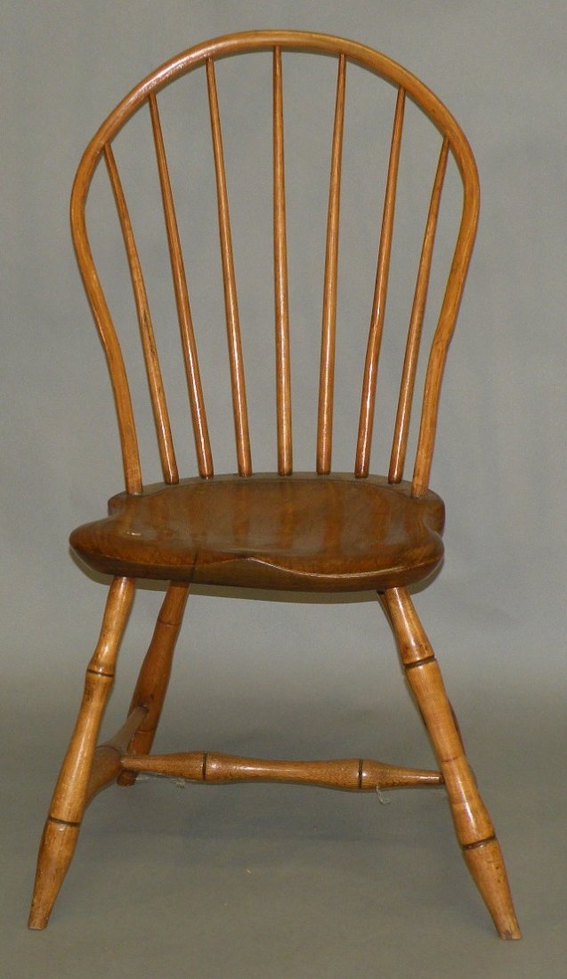 Bow-back Windsor chair: ca. 1790-1810; saddle seat with a swelled “H” stretcher, 15”x 15 ½”x 35 ½”;