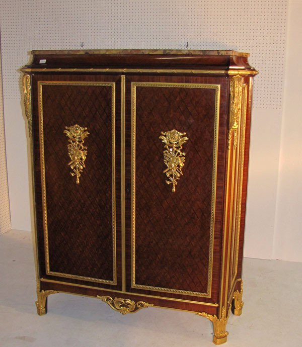 A Fine Louis XVI style gilt-bronze mounted kingwoo: A Fine Louis XVI style gilt-bronze mounted kingwood cabinet, in the manner of Francois Linke, French 19th century. The rectangular breche d'alep marble top over a conforming case with two long doors e