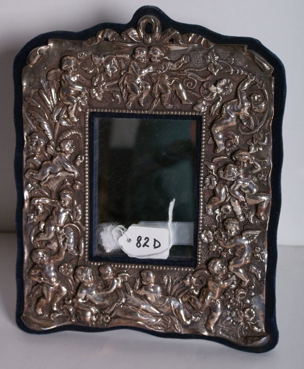 English sterling silver repousse mirror, hallmarke: English sterling silver repousse mirror, hallmarked: W H (William Hunter), London, date letter 'b' (1897) and King George IV. 12" x 9 1/4"