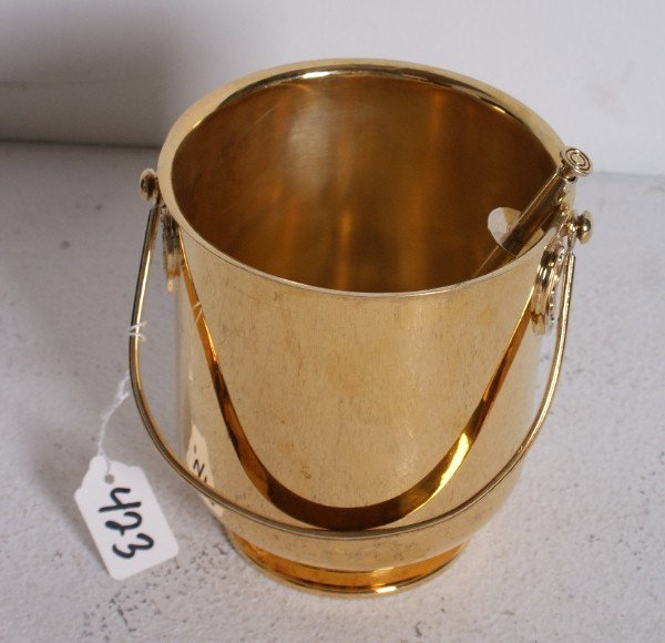 Christofle vermeil ice bucket and tongs. H: 6" Dia: Christofle vermeil ice bucket and tongs. H: 6" Diameter: 5 1/2" Note: Ding in bucket.