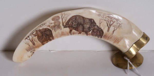 Carved scrimshaw ivory tusk with buffalo, signed: Carved scrimshaw ivory tusk with water buffalo, signed. 7"