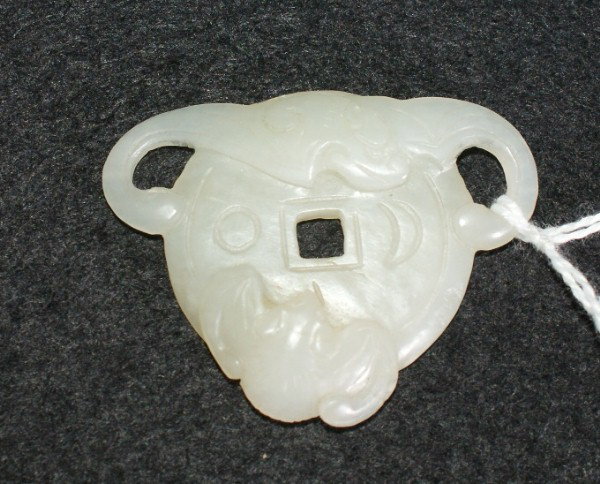Chinese nephrite white jade coin: Chinese nephrite white jade coin with two bats, late Ching dynasty. 1 3/4" x 1 1/2"