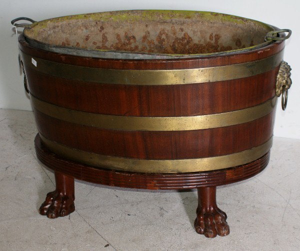 George III brass bound mahogany wine cooler, 19th : George III brass bound mahogany wine cooler, 19th century. H: 18 1/2" W: 29" D: 20"