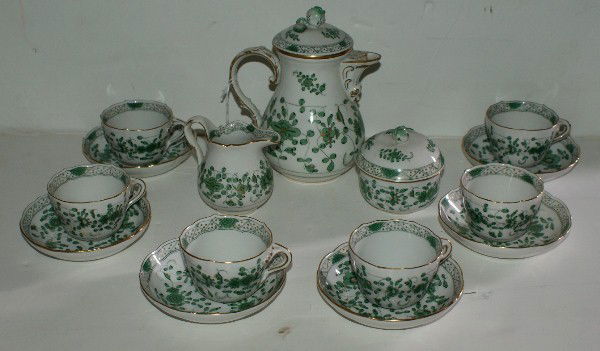 Meissen porcelain 15-piece chocolate set, comprisi: Meissen porcelain 15-piece chocolate set, comprising: chocolate pot, sugar, creamer, 6 cups and saucers, Meissen cross sword mark. Tallest: 6 1/2"