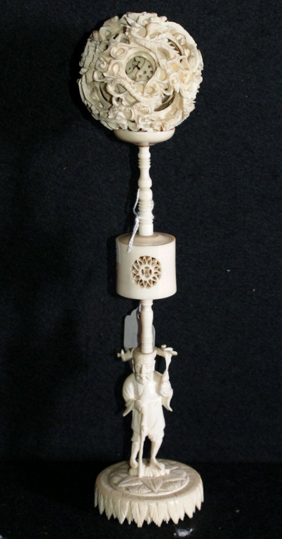 Chinese carved ivory puzzle ball and figural sta: Chinese carved ivory puzzle ball and figural stand. Ivory: 10 1/2"