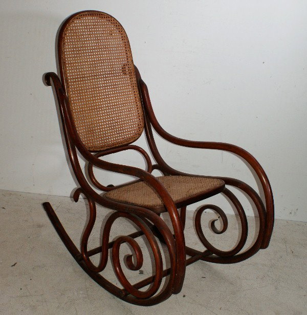 Thonet style bentwood rocking with cane seat and: Thonet style bentwood rocking with cane seat and back, circa 1890, signed: Kohn and located: Austria. H: 43 1/2"
