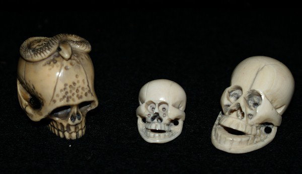 3 Japanese carved ivory netsuke: skulls. 1", 1 1/2", 1 3/4"