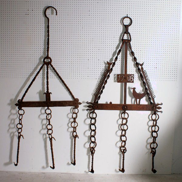 Two primitive wrought iron: hanging pot racks. H: 74" W: 37"