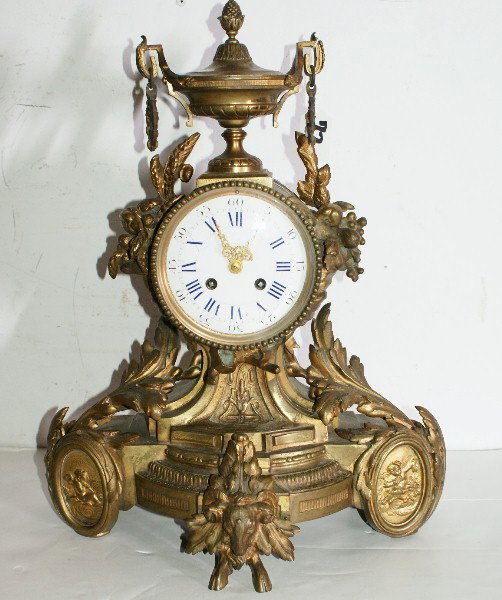 French Japy Frères Louis XV Rococo style bronze man: 19th century French Japy Frères Louis XV Rococo style bronze mantle clock; baluster-form surmounted with an urn and removable cover. H: 17 1/2"