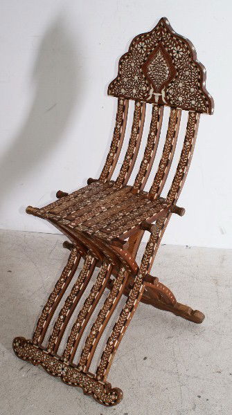 Middle Eastern carved teak ivory and ebony inlaid: Middle Eastern carved teak ivory and ebony inlaid chair. H: 42"