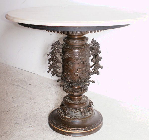 Intricate Chinese bronze base marble-top table: Intricate Chinese bronze base marble-top table, 19th century. H: 25 1/2" D: 30 1/4"