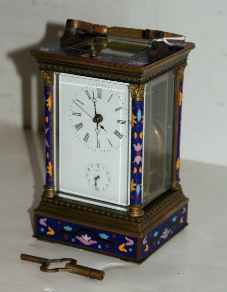 Bronze and champleve enamel carriage clock: Bronze and champleve enamel carriage clock. H: 8 1/4" W: 4" D: 3 1/2"