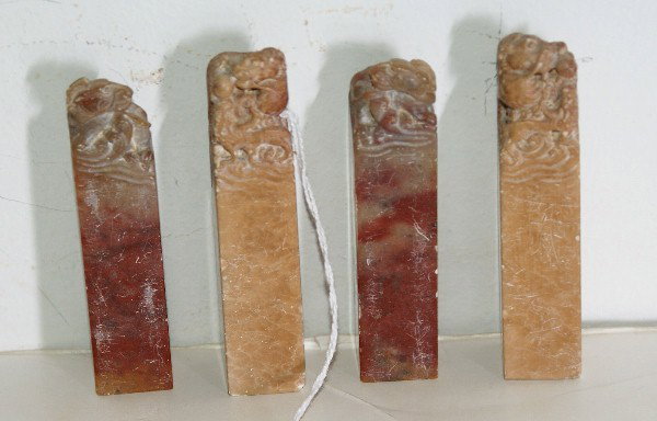 Four Chinese carved figural soapstone seals: Four Chinese carved soapstone seals, H: 3 1/4"