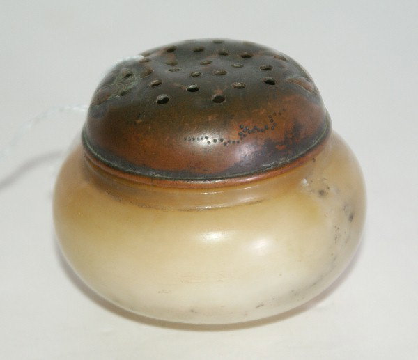 Chinese carved white and pale russet jade cricket: Chinese carved white and pale russet jade cricket box, the copper cover with two butterflies. H: 2" D: 2 1/2"