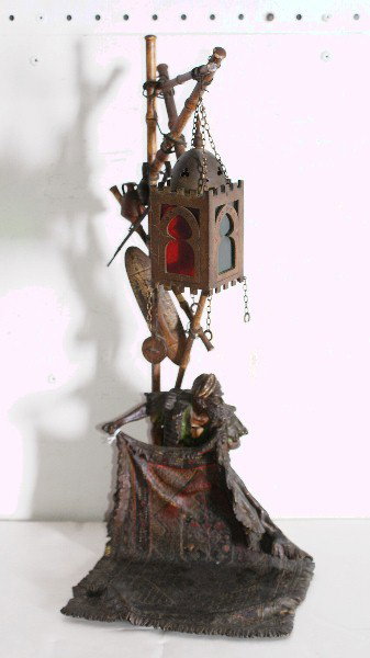 Franz Bergman bronze lamp modeled as a Carpet Selle: Franz Bergman bronze lamp modeled as a Carpet Seller, signed to the underside with the Bergman seal and Geschutzt. H: 18"