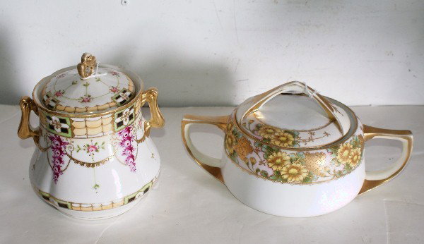 Two Nippon hand-painted porcelain covered jars.: Two Nippon hand-painted porcelain covered jars. Tallest: 7"
