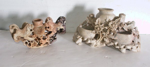 Two Chinese carved soapstone pieces;: a triple vase and a single vase with Foo dogs. Largest: 10"