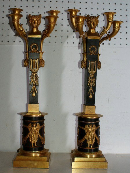 Important pair of 19th century Russian/Polish ormolu: Important pair of 19th century Russian/Polish ormolu and patinated bronze candlesticks, stamped: Br. Topienscy, Warszawa. H: 22 1/2" Note: The Russian Empire census of 1897 recorded Warsaw the third-l