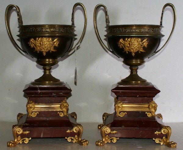 Impressive pair of French 19th C bronze ormolu and: Impressive pair of French 19th C bronze ormolu and rouge royal marble urns. H: 15 1/2" Diameter over handles: 9 1/2"