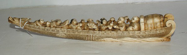 Chinese carved ivory dragon junk with seven figures: Chinese carved ivory dragon junk with seven figures., signed. 12 3/4"