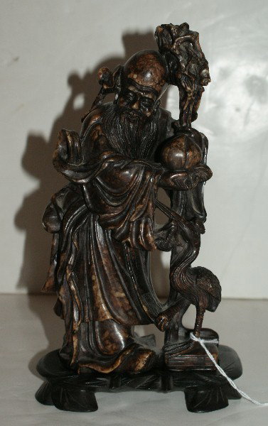 169.: Chinese carved soapstone figure: of a sage and phoenix bird on carved wood stand. Overall: 9 1/2" Figure: 8 1/2"