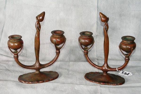 Pair of Tiffany Studios two-light bronze candlesti: Pair of Tiffany Studios two-light bronze candlesticks, inscribed Tiffany Studios, New York, #1280 and the TS decorating logo. 9"