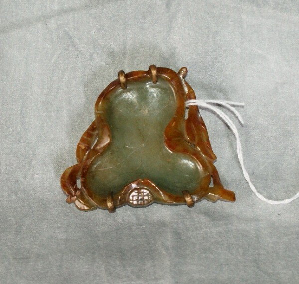 Chinese carved celadon and russet jade leaf form b: Chinese carved celadon and russet jade leaf form brush washer in a bronze frame on carved carnelian feet. 2 1/4" x 2 1/2"