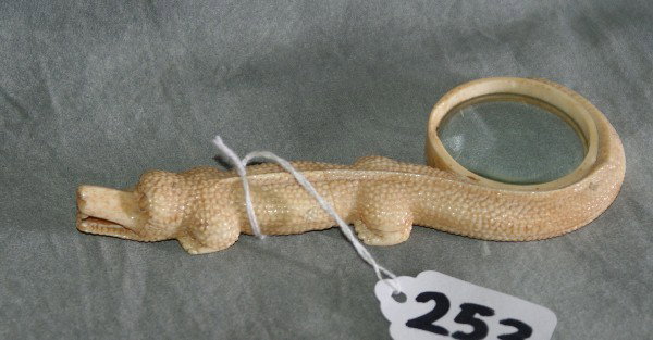 Ivory figural magnifying glass: Ivory figural magnifying glass on an aligator. L:5.5"