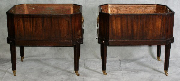 Pair of English Wood Planters/Cellarettes: Pair of English Wood Planters/Cellarettes with lion form bronze handles raised on bronze casters with tin liners, H:24" L:28.5" D:20"