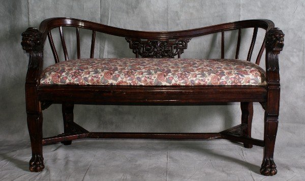 Antique Chinese Dragons head and claw foot two sea: Antique Chinese Dragons head and claw foot two seat fruitwood settee with a stretcher base with glass eyes . L: 42"