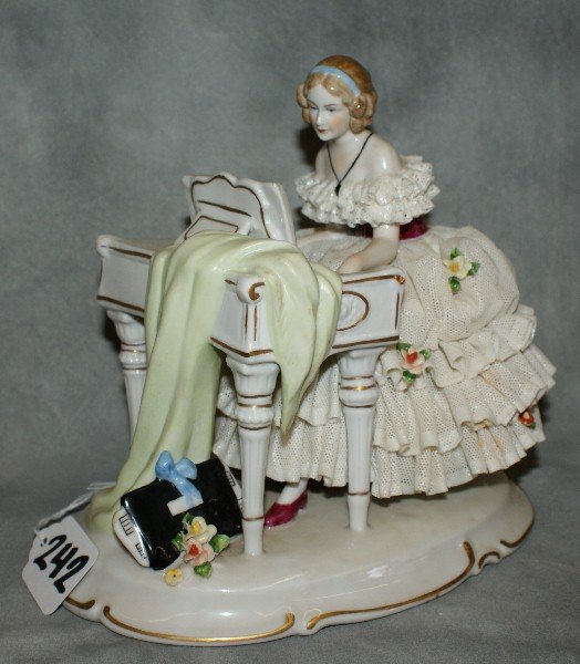 Dresden girl playing piano.: Dresden girl playing piano. H:7" L:8"