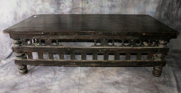 Carved cocktail table: Carved cocktail table. H: 18" W: 58" D : 29"